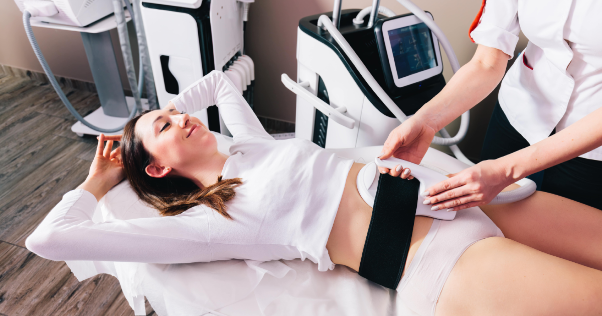 Woman receiving CoolTone body contouring treatment on abdomen in Seattle, WA